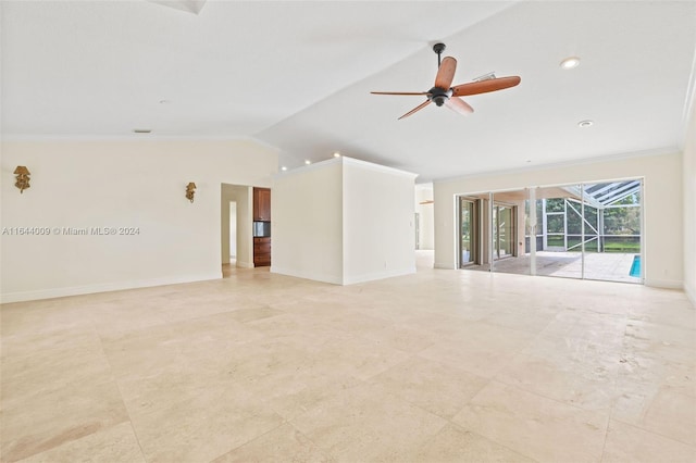 empty room with ceiling fan, lofted ceiling, and ornamental molding