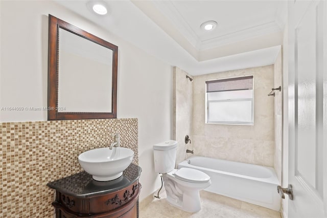 full bathroom featuring crown molding, tiled shower / bath combo, vanity, and toilet