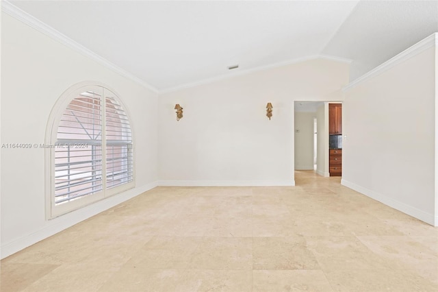 spare room with ornamental molding and lofted ceiling