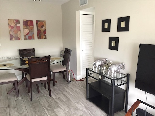 dining space featuring light wood-type flooring