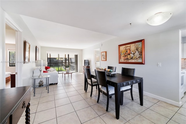 dining room featuring light tile patterned floors