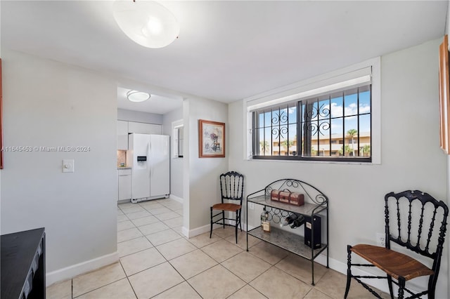 living area with light tile patterned floors