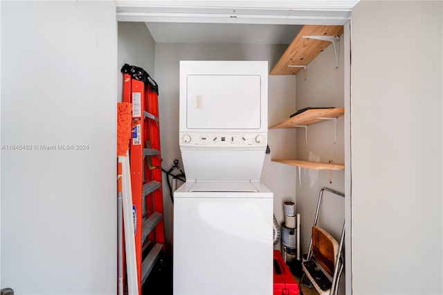 laundry area featuring stacked washer and clothes dryer