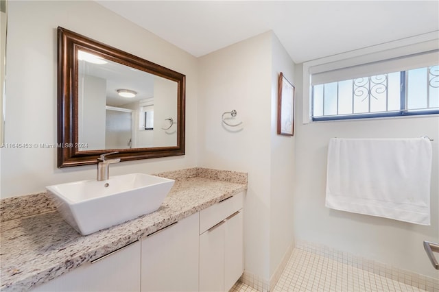 bathroom with vanity and tile patterned floors