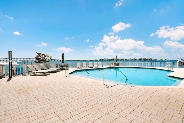 view of swimming pool featuring a patio area