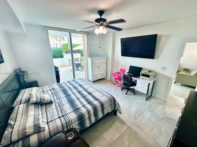 bedroom featuring ceiling fan, a textured ceiling, and access to outside