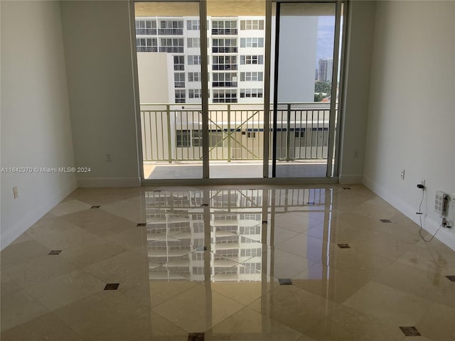 spare room featuring tile patterned flooring