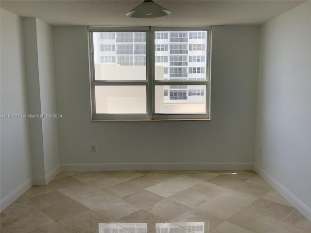 view of tiled empty room