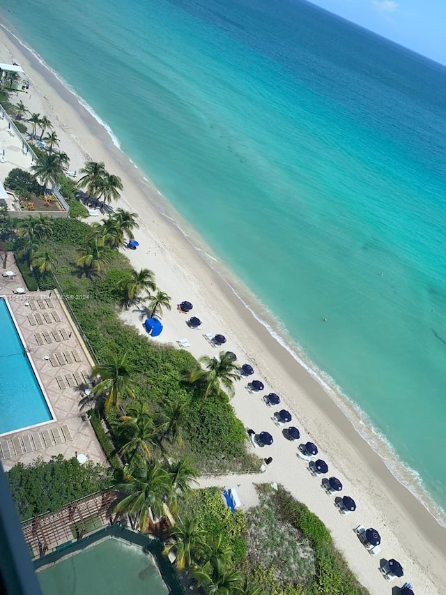 drone / aerial view with a water view and a view of the beach