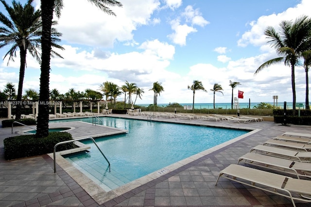 view of swimming pool featuring a patio