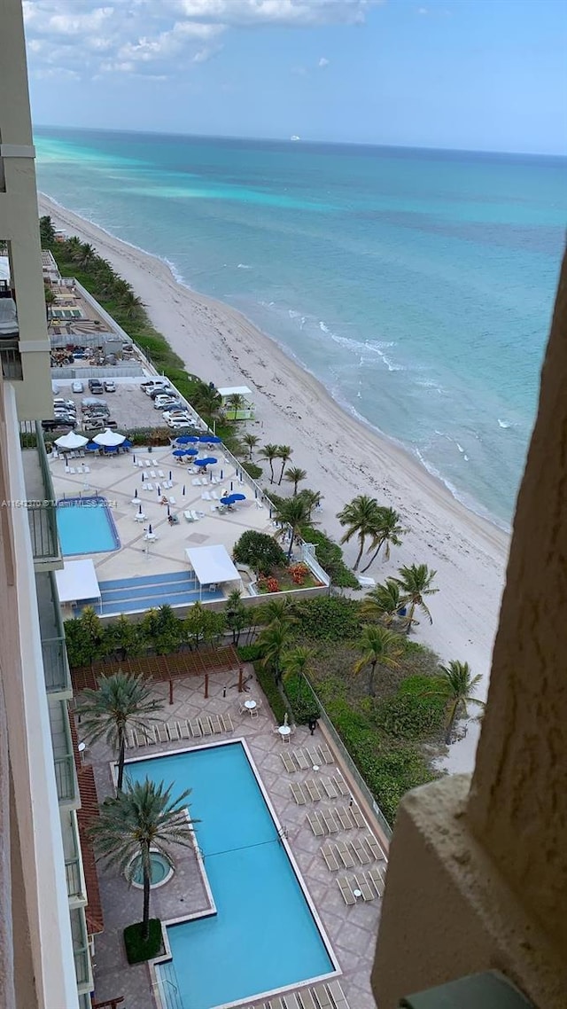 exterior space featuring a view of the beach and a water view