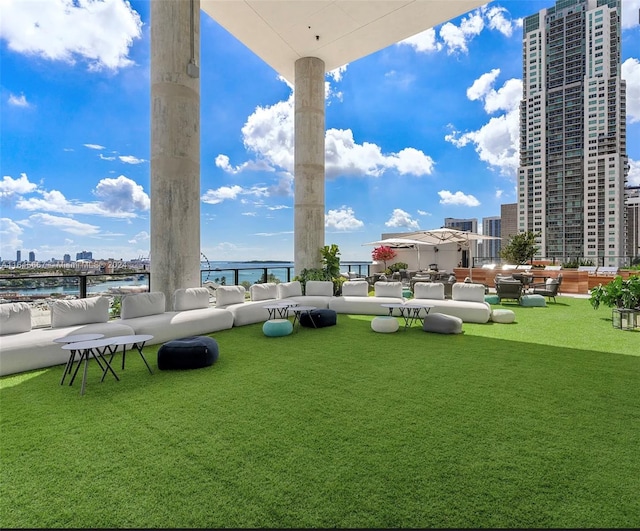 exterior space with a water view and outdoor lounge area