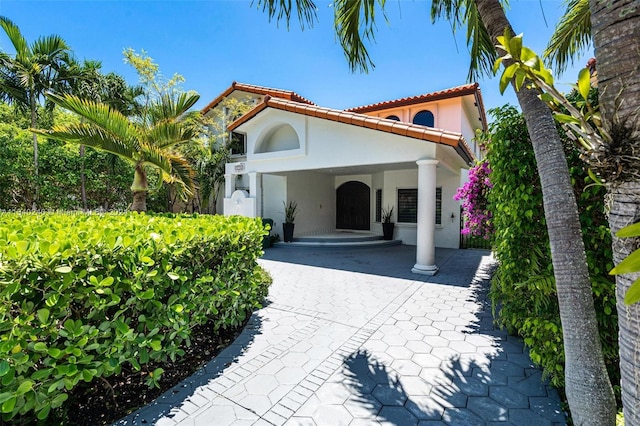 mediterranean / spanish-style house featuring a carport