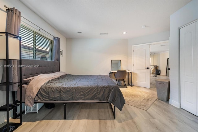 bedroom featuring light wood-type flooring