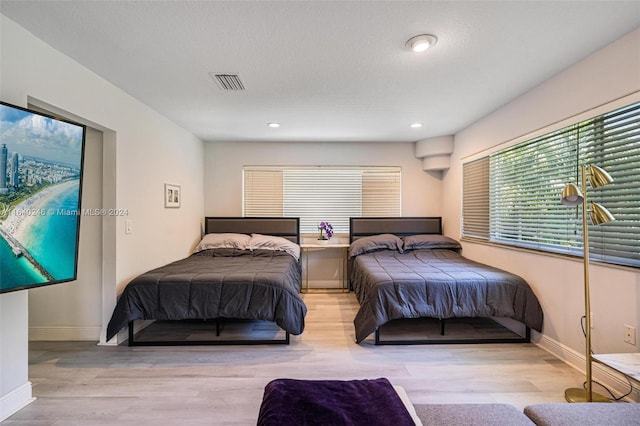 bedroom with light hardwood / wood-style flooring