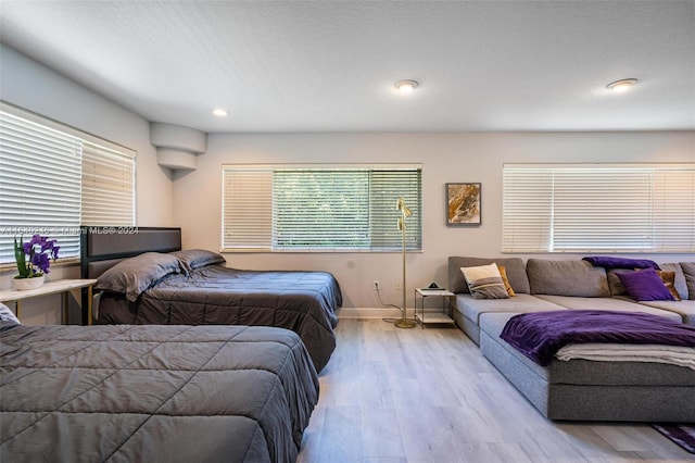 bedroom with light hardwood / wood-style floors