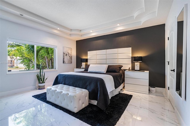 tiled bedroom featuring a raised ceiling