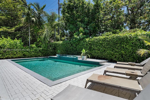 view of swimming pool with a patio