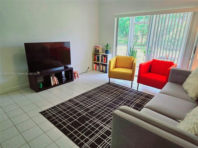 living room with tile patterned flooring