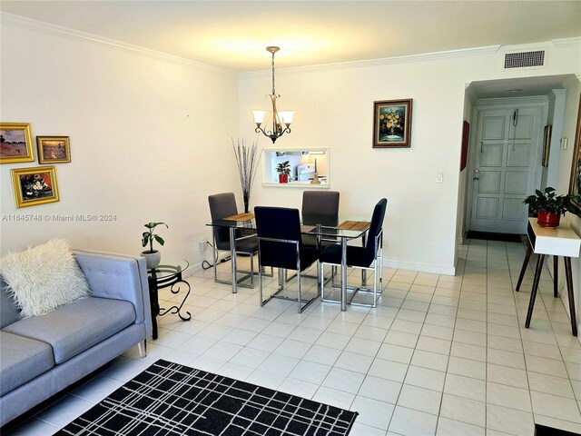 tiled dining area with an inviting chandelier and crown molding