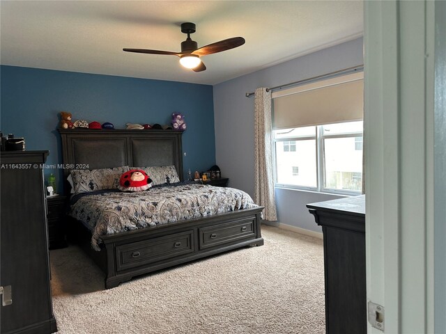 bedroom with ceiling fan and carpet flooring