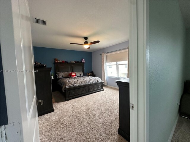 carpeted bedroom featuring ceiling fan