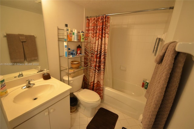 full bathroom featuring shower / bath combo with shower curtain, tile patterned floors, a textured ceiling, vanity, and toilet