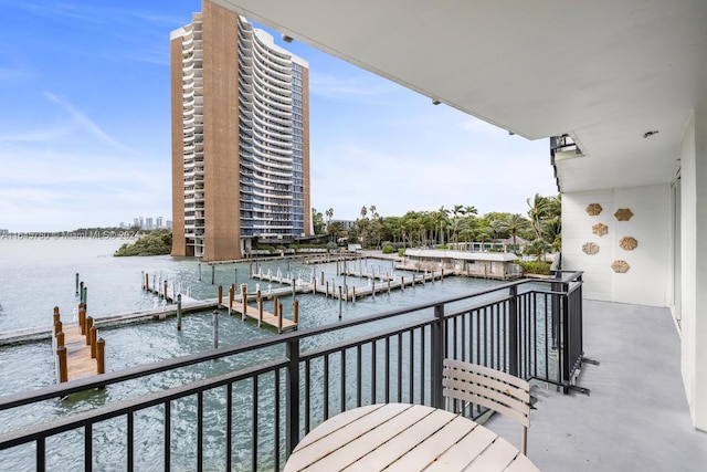 balcony featuring a dock and a water view