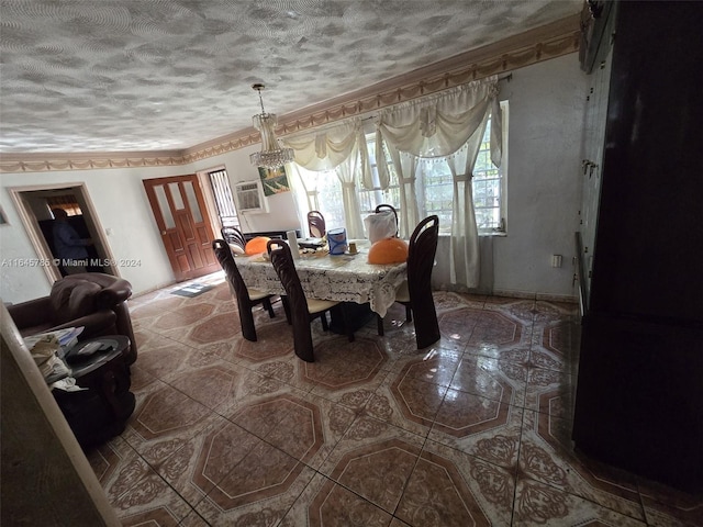 dining room with tile patterned flooring and a textured ceiling