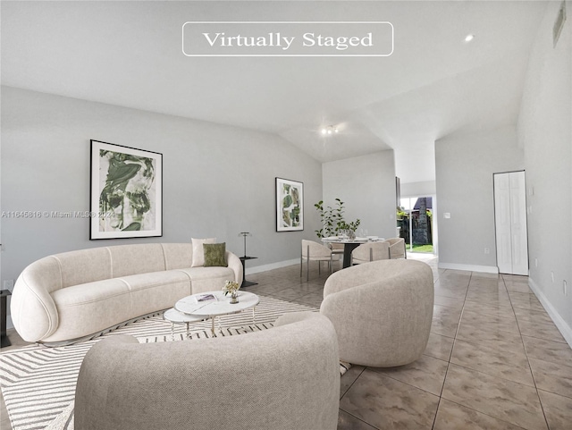 living room with light tile patterned floors and vaulted ceiling