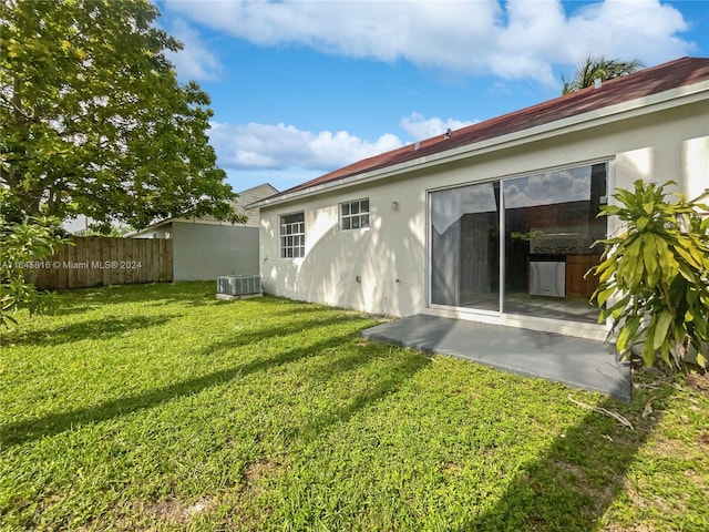 exterior space featuring central AC unit, a patio area, and fence