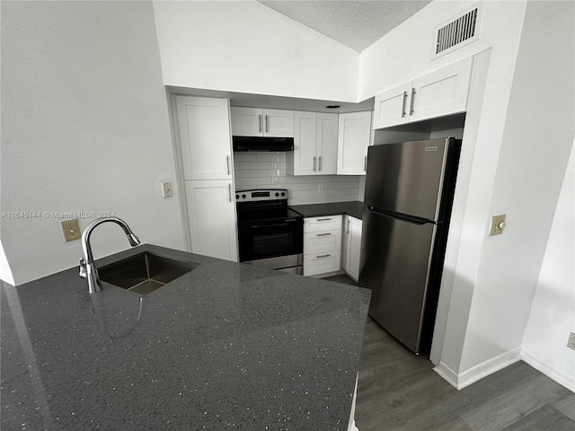 kitchen featuring white cabinets, backsplash, appliances with stainless steel finishes, sink, and dark wood-type flooring