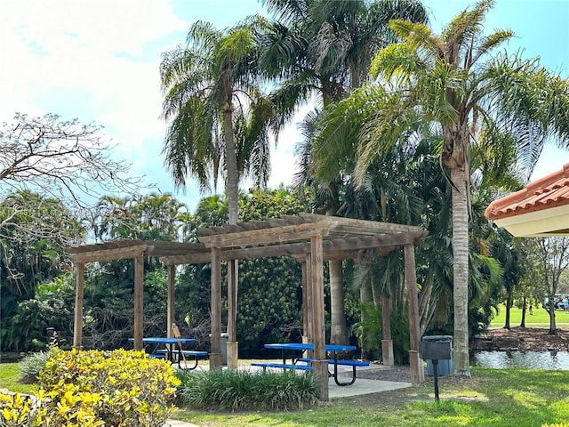 view of community featuring a pergola and a water view