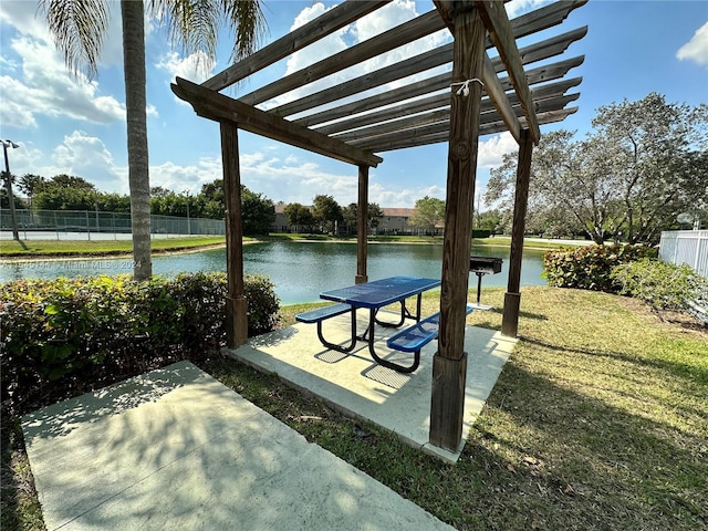 surrounding community featuring a water view, a yard, a patio area, and a pergola