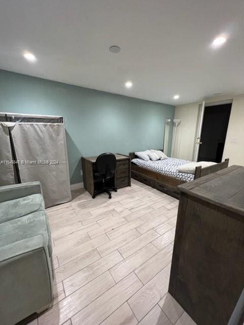 bedroom featuring light wood-type flooring