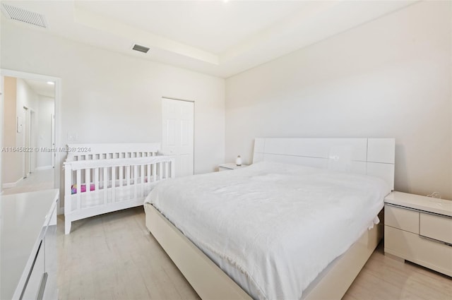 bedroom with light hardwood / wood-style floors