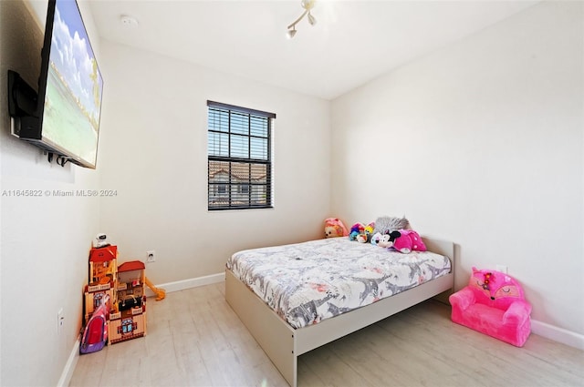 bedroom featuring light hardwood / wood-style floors