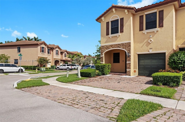 mediterranean / spanish-style home featuring a garage