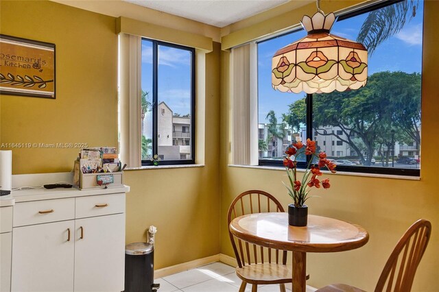 dining area with light tile patterned floors