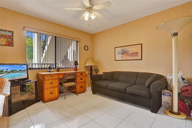 home office featuring ceiling fan and a textured ceiling