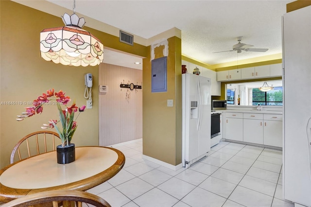 kitchen with white cabinetry, ceiling fan, electric panel, white appliances, and light tile patterned floors