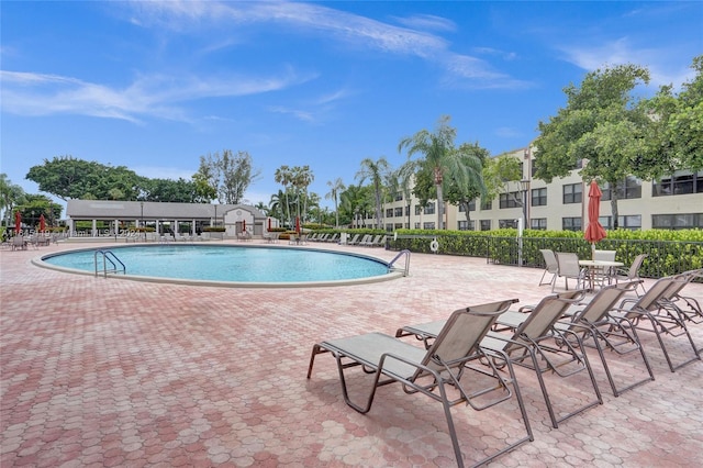 view of swimming pool featuring a patio area