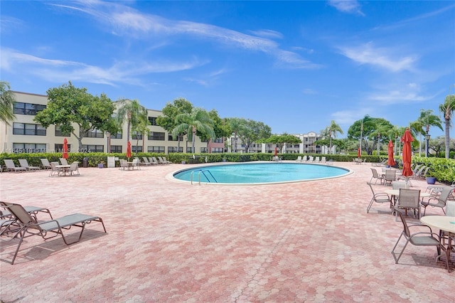 view of pool featuring a patio area