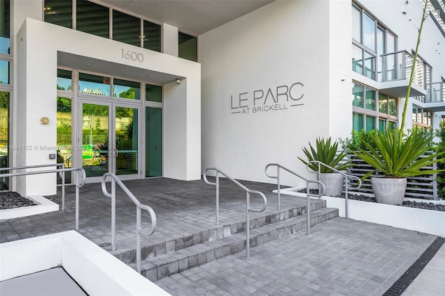 1600 SW 1st Ave Unit 614, Miami, FL 33129 - view of exterior entry featuring stucco siding and french doors