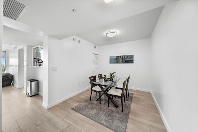 dining area featuring light wood-type flooring