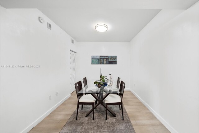 1600 SW 1st Ave Unit 614, Miami, FL 33129 - dining area with baseboards, visible vents, and light wood-type flooring