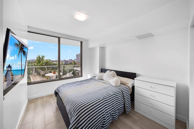 bedroom with light wood-type flooring