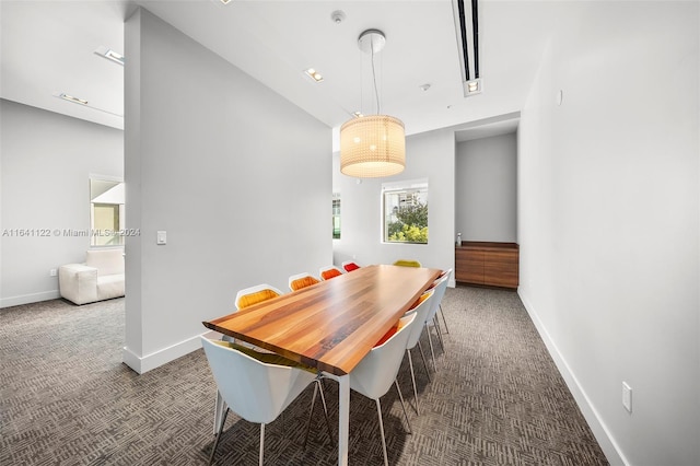 dining area featuring carpet flooring