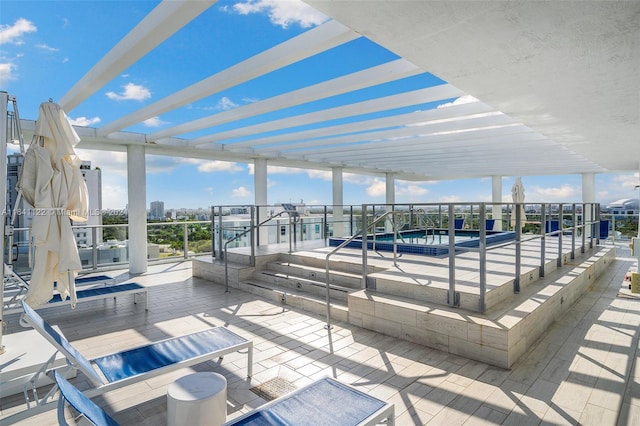 view of patio with a jacuzzi and a pergola