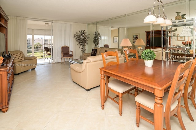 dining area featuring light tile patterned flooring